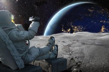 an astronaut sits on the moon and takes a photo of earth