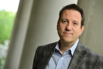 Professional headshot of Derek Cummings.